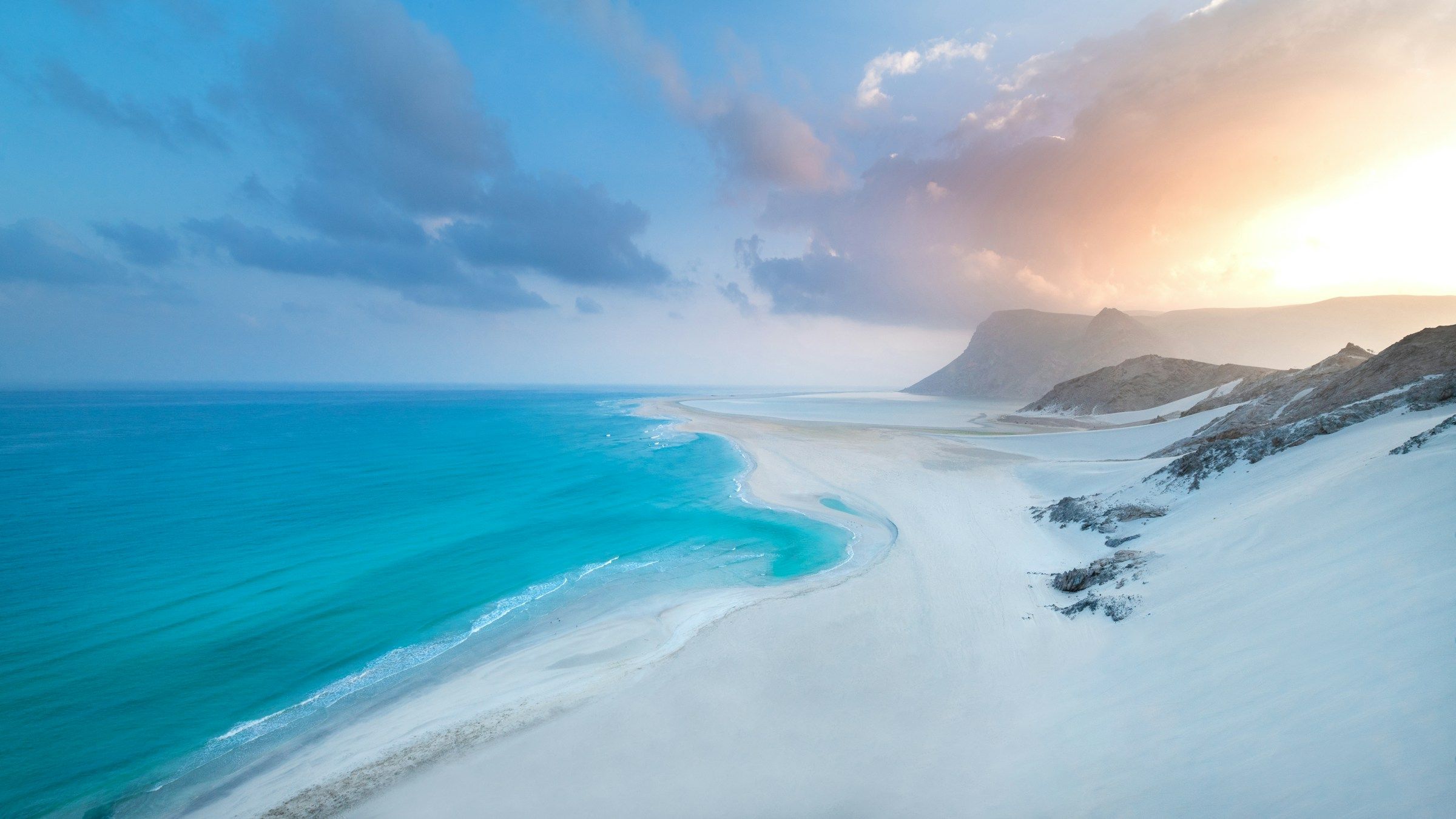Aerial view of the white sand spit and turquoise water of Detwah Lagoon near Qalansiyah